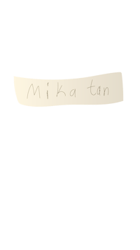 the word mika tan written in gold on a black background